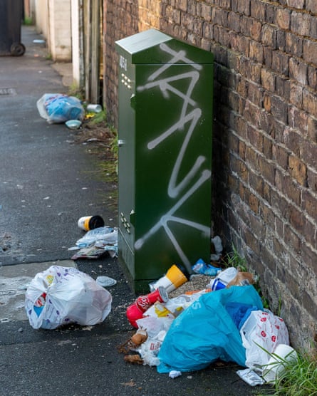 Rubbish left by a wall