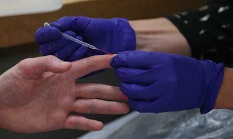 A Covid fingertip test being carried out in London.