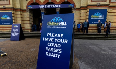 A sign asking fans to have Covid passes ready