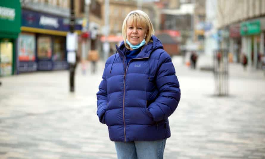Karen Grant standing in the pedestrianised shopping area with her hands in the pockets of her blue winter coat