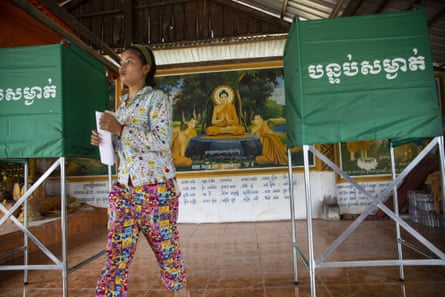 Cambodians cast their vote during an election that has been widely criticised