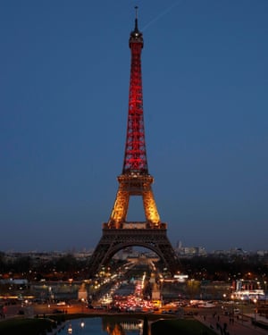 The Eiffel Tower is seen with the black, yellow and red colours of the Belgian flag in tribute to the victims of today’s Brussels bomb attacks in Paris.