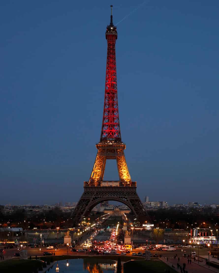 The Eiffel Tower is seen with the black, yellow and red colours of the Belgian flag in tribute to the victims of today’s Brussels bomb attacks in Paris.