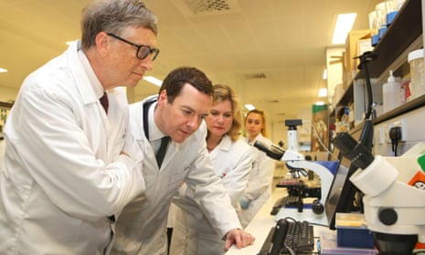 Bill Gates and George Osborne tour a research lab at the Liverpool School of Tropical Medicine.