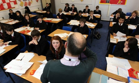A teacher and pupils in a classroom
