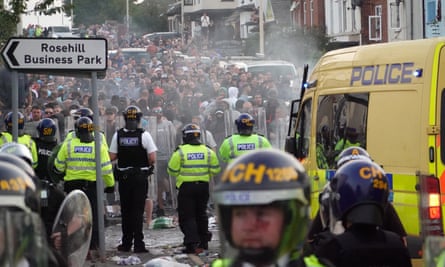Riot police holding back crowds on Tuesday evening.