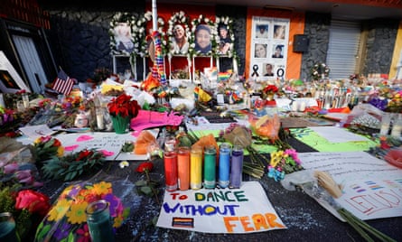 Flowers, candles, and mementos are left at a memorial after a mass shooting at the LGBTQ nightclub Club Q in Colorado Springs.