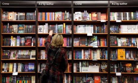 Woman buying crime fiction books, Waterstones bookshop, Cambridge UK