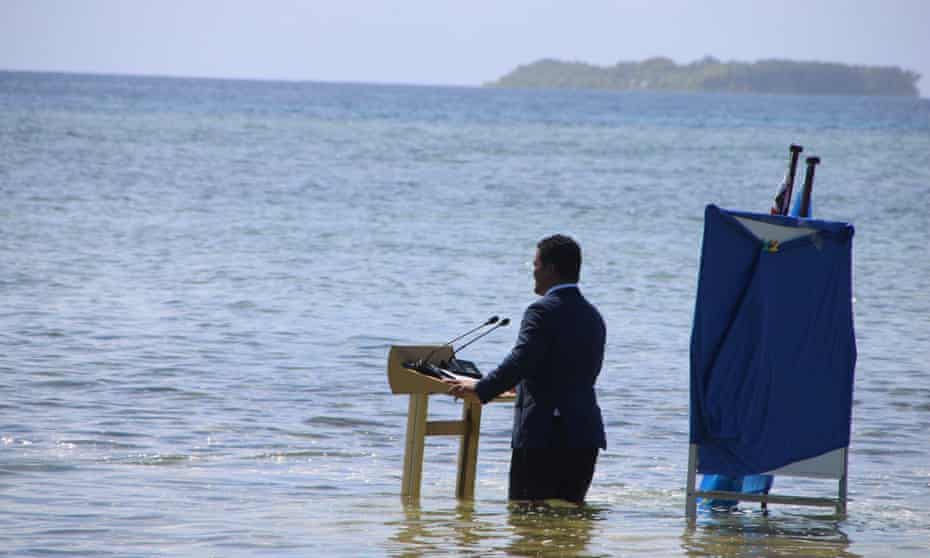 Tuvalu's foreign minister, Simon Kofe, gave a speech to Cop26 delegates while knee-deep in water, illustrating the island nation's vulnerability to sea level rises.
