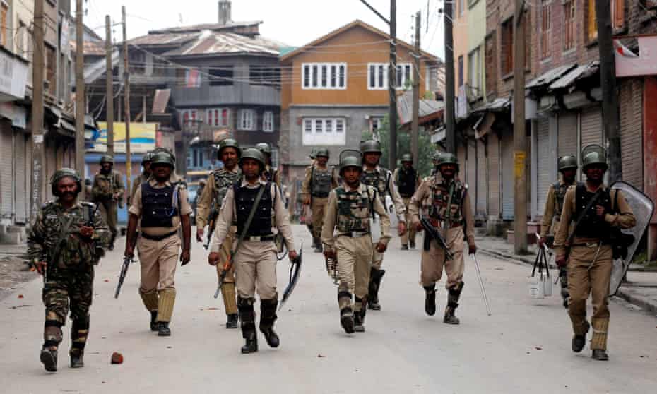 Indian paramilitary soldiers patrol the Batamaloo area of Srinagar, the summer capital of Indian Kashmir. Police and paramilitary presence has intensified since clashes broke out in the valley region in July. 