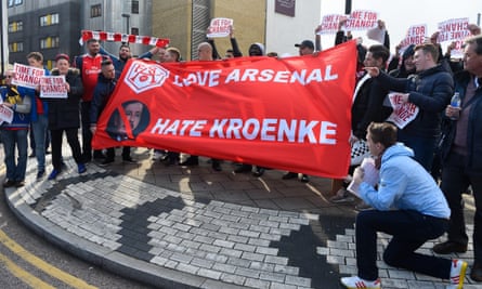 Arsenal fans display a message for Kroenke prior to a Premier League match against Norwich in 2016.
