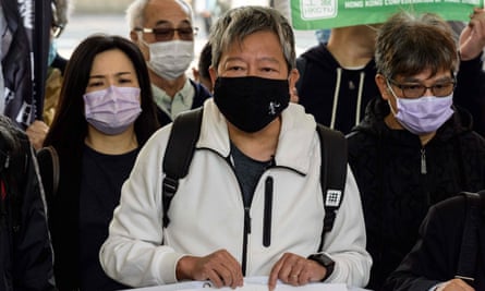 Hong Kong pro-democracy activist Lee Cheuk-yan (centre) arrives at the court in Hong Kong on Tuesday.