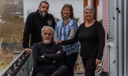 Jasmin Elezović with his mother, Alma (right), his father Ermin (seated) and family friend Lynne Kuschel, posing on a balcony at the family home
