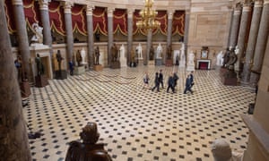 Impeachment articles against Donald Trump being delivered in the Capitol building.