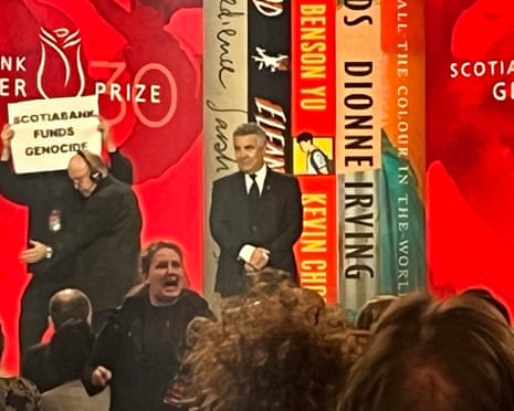 A protester is escorted off the stage during the Scotiabank Giller prizegiving in Toronto last year.