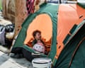 A displaced child inside a tent in Beirut, Lebanon.