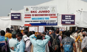 People queue outside a vaccine centre in Mumbai.