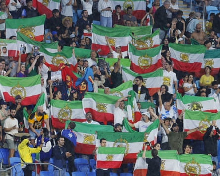 Iran fans wave flags during their team’s loss to the Philippines at the Women’s Asian Cup.