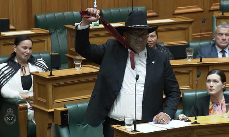 New Zealand’s Māori party co-leader Rawiri Waititi uses a tie to simulate a noose during his maiden speech in Wellington in February 2021.