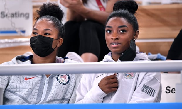 Simone Biles, right and Jordan Chiles watch the women’s individual all-around final
