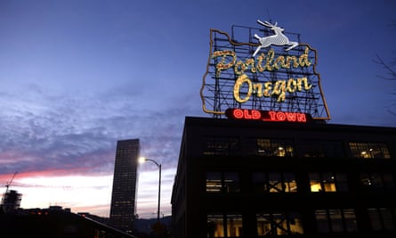 The “Portland, Oregon” sign is seen atop in building in downtown Portland, Ore.