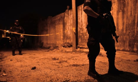 Police guard a crime scene in Veracruz state, the setting for Hurricane Season