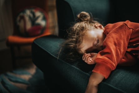 Little girl having a nap on a sofa