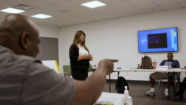 Woman standing in the center of a room