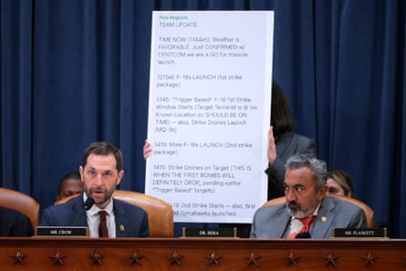 a poster behind a man