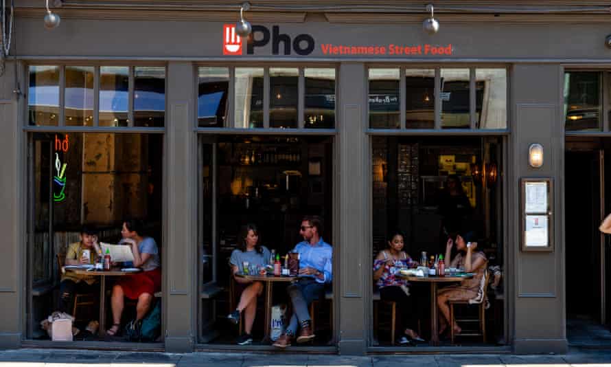‘It’s not about big brands’: how will UK casual dining fare after Covid? | Hospitality industry 4 People Eating At Pho Vietnamese Restaurant, Spitalfields, London