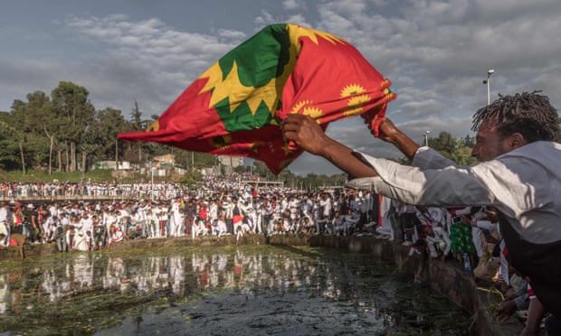 A man waves an Oromo flag during a gathering in Addis Ababa. 