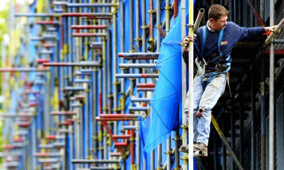 A worker on scaffolding in London