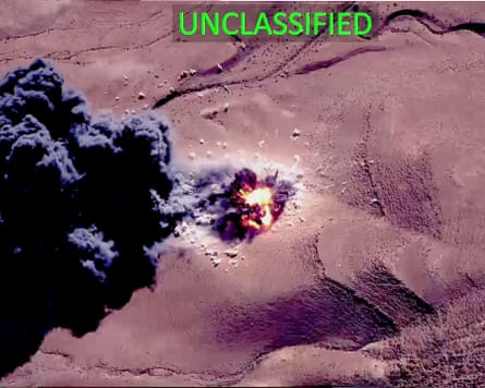 An image of one of the airstrikes in a desert with a red explosion and rising black smoke