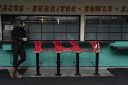 Stools are taped off to prevent diners from sitting on them in Los Angeles.