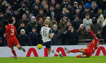 Lucas Bergvall slots the ball home despite the desperate efforts of Virgil van Dijk to give Tottenham something to cling on to at Anfield.