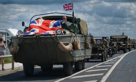 Vintage army vehicles head to head into Arromanches in Normandy