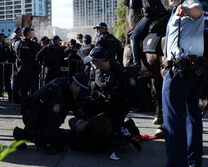 Twelve protesters charged after confrontation with police at Sydney weapons expo