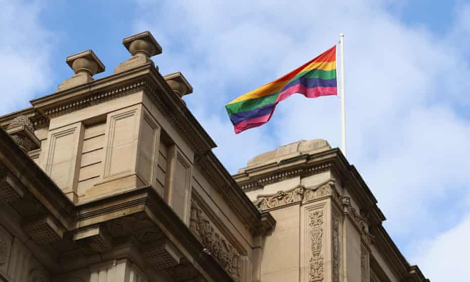A rainbow flag is seen above Parliament House in Victoria as premier Daniel Andrews makes an apology for laws criminalising homosexuality. 