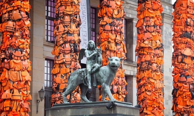 Ai weiwei's installation of life jackets, used by migrants, attached to the pillars of Berlin’s Konzerthaus in 2016.