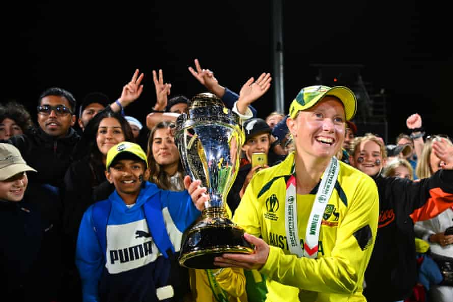 World Cup’s highest run-scorer and player of the tournament Alyssa Healy of Australia poses with the trophy in front of fans.