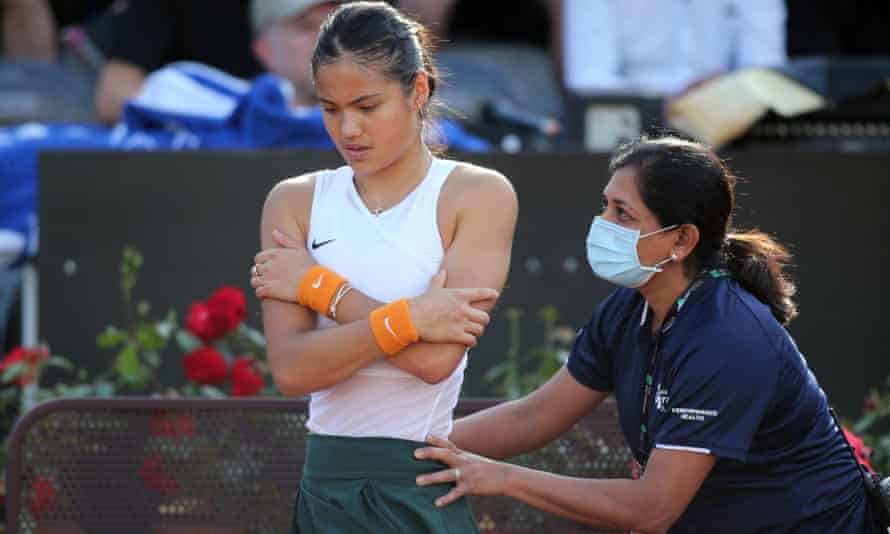 Emma Raducanu receives treatment during her match against Bianca Andreescu.