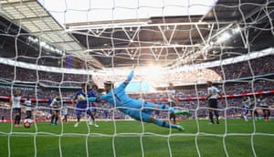 Hugo Lloris dives in vain to stop the shot from Eden Hazard to score Chelsea’s third.