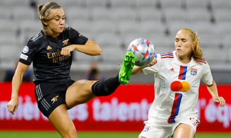 Lyon’s Janice Cayman (right) looks on as Arsenal’s Katie McCabe clears the ball.