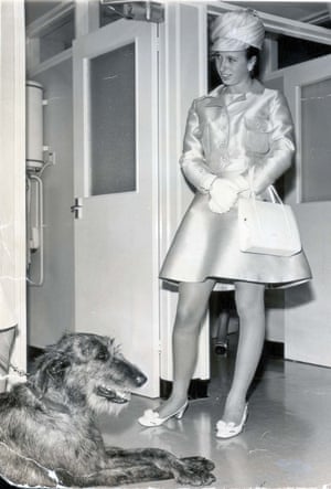 The original picture caption describes this look ‘an Ice-blue dress and jacket with a multi-coloured jockey cap’ for a visit to open an animal hospital in Suffolk, in 1969.