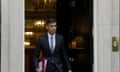 Rishi Sunak leaving 10 Downing Street holding a dark red folder. The black door with the number 10 is visible behind him.