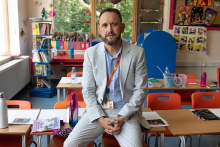 Chris Ashley-Jones sat in an empty school classroom