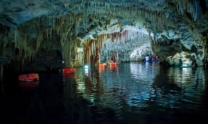 Stalagmites and stalactites in the caves of Diros in Greece.