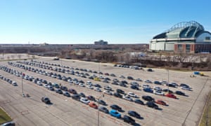 Cars lined up at a testing centre at Miller Park basball stadium in Milwaukee, Wisconsin, as the state reported a seven-day average Covid-19 positivity rate of nearly 40%.