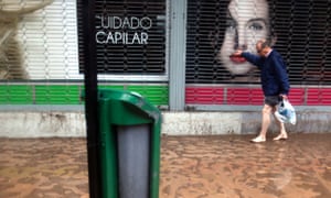 A street flooded from the overflowing of the Mapocho river during heavy rains in Santiago on April