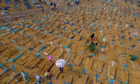 People visit the Nossa Senhora Aparecida cemetery in Manaus, Brazil.